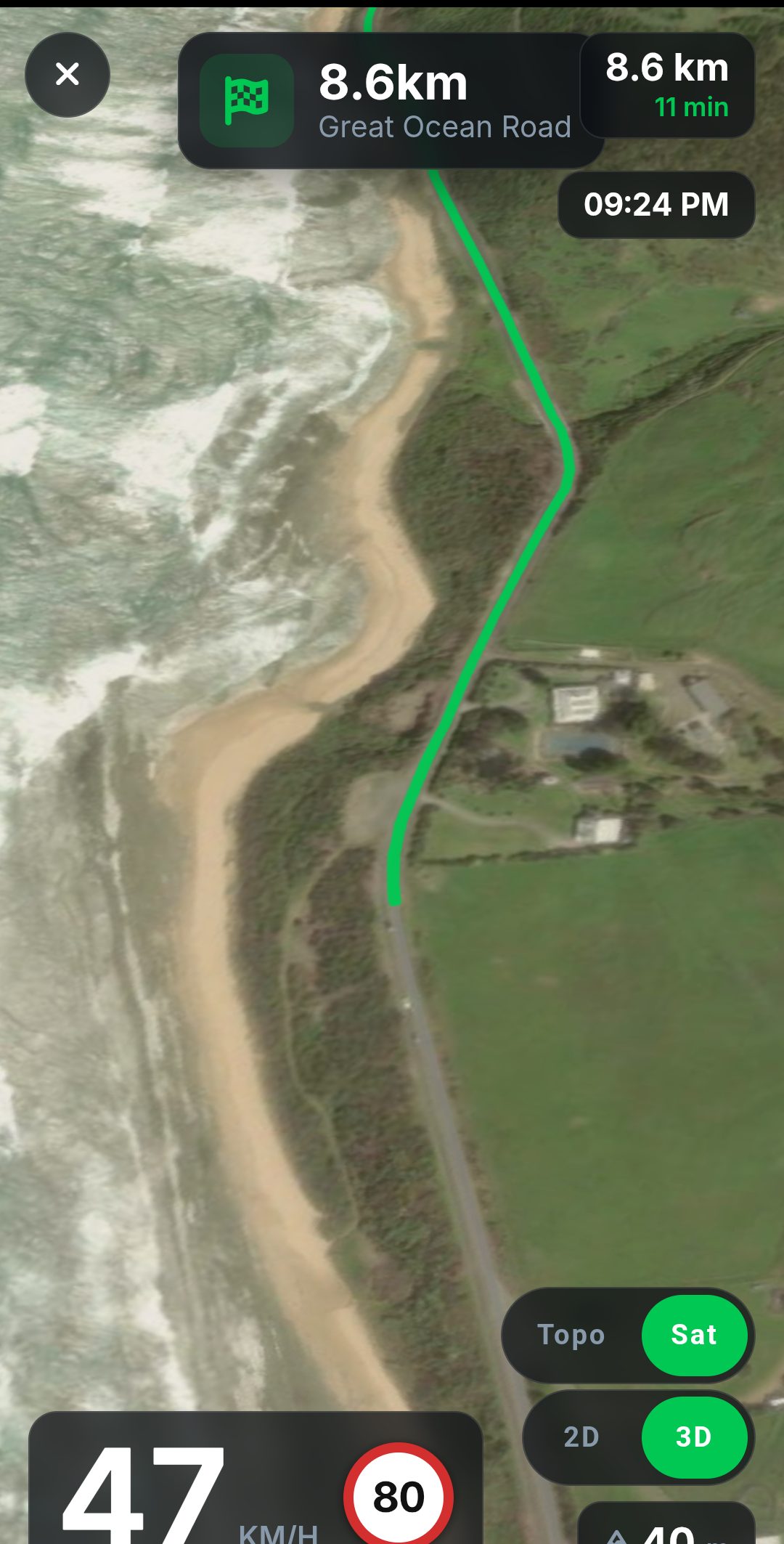 Turn-by-turn navigation on a phone in 3D satellite view down the Great Ocean Road, showing Cape Patton Lookout 511m ahead, 18km and 15 minutes remaining, and 72 km/h against an 80 limit.